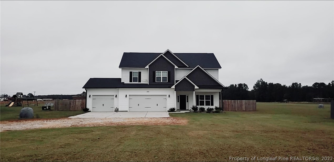 3720 Thrower Road Hope Mills, NC 28348 - Photo 1 of 26 a front view of a house with parking space