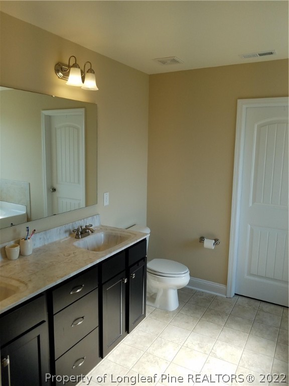 3720 Thrower Road Hope Mills, NC 28348 - Photo 17 of 26 a bathroom with a sink and a toilet
