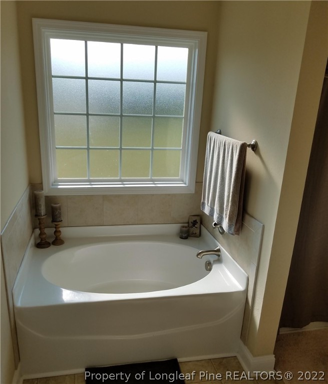 3720 Thrower Road Hope Mills, NC 28348 - Photo 18 of 26 a bathroom with a bathtub