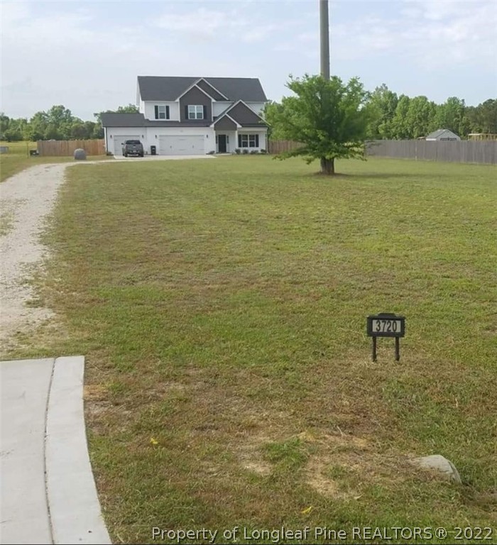 3720 Thrower Road Hope Mills, NC 28348 - Photo 2 of 26 a house view with lake view