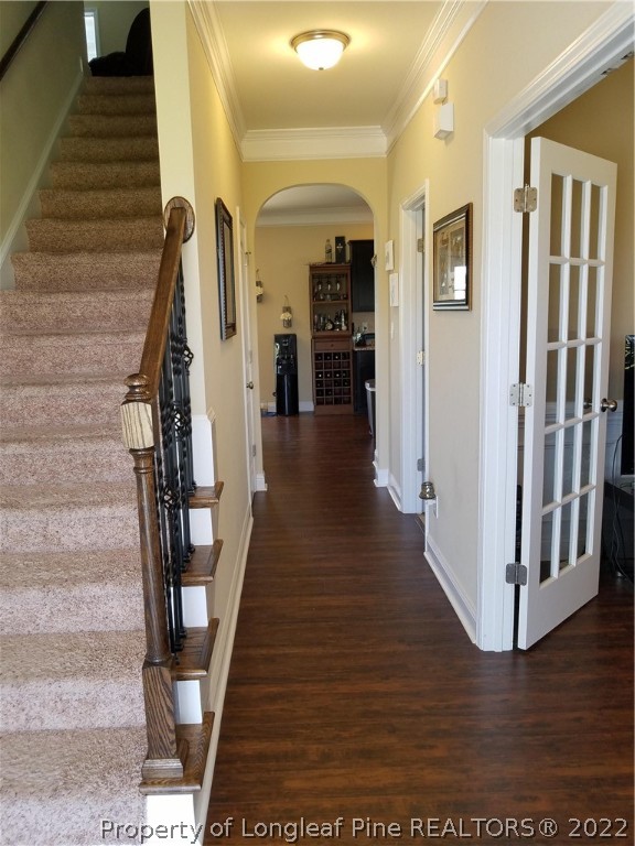 3720 Thrower Road Hope Mills, NC 28348 - Photo 3 of 26 a view of a hallway with wooden floor and staircase