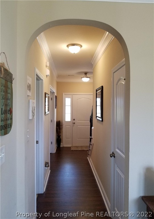 3720 Thrower Road Hope Mills, NC 28348 - Photo 4 of 26 a view of a hallway with wooden floor and a bathroom