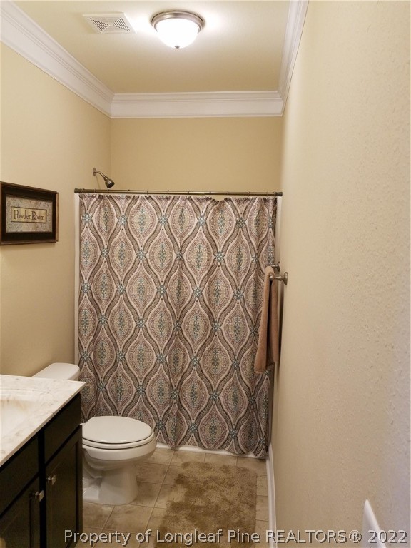 3720 Thrower Road Hope Mills, NC 28348 - Photo 6 of 26 a bathroom with a toilet and a shower curtain