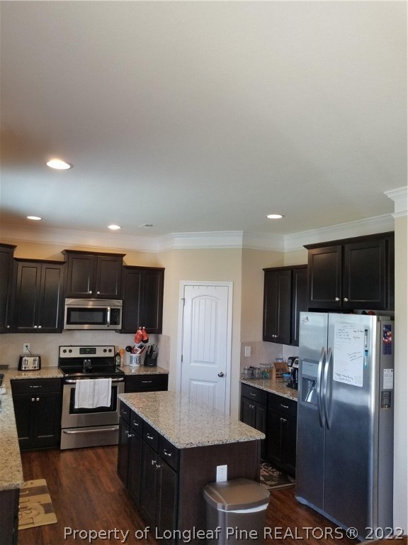 3720 Thrower Road Hope Mills, NC 28348 - Photo 10 of 26 a kitchen with stainless steel appliances granite countertop a refrigerator stove microwave and sink