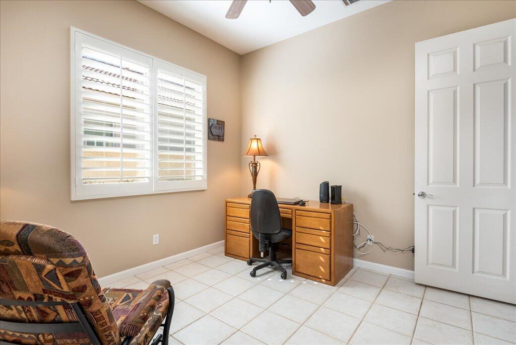 49562 Wayne Street Indio, CA 92201 - Photo 14 of 52 a work room with furniture and two window