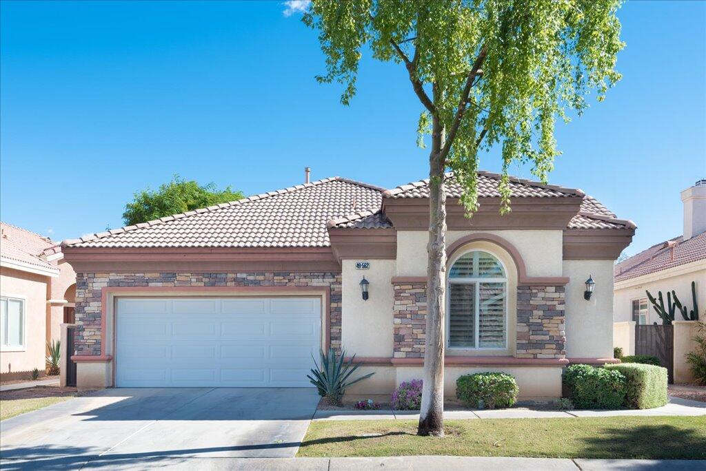 49562 Wayne Street Indio, CA 92201 - Photo 2 of 52 front view of a house with a tree