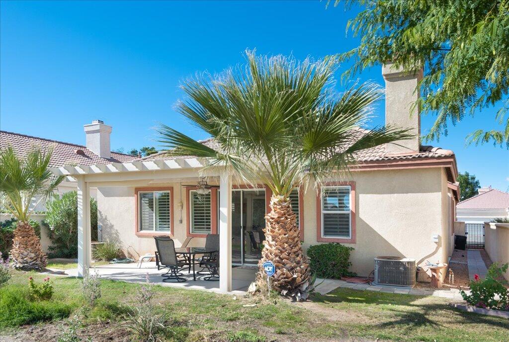 49562 Wayne Street Indio, CA 92201 - Photo 33 of 52 a front view of a house with garden and patio