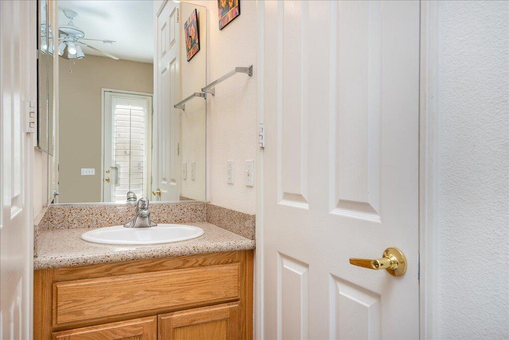 49562 Wayne Street Indio, CA 92201 - Photo 40 of 52 a bathroom with a sink and a mirror