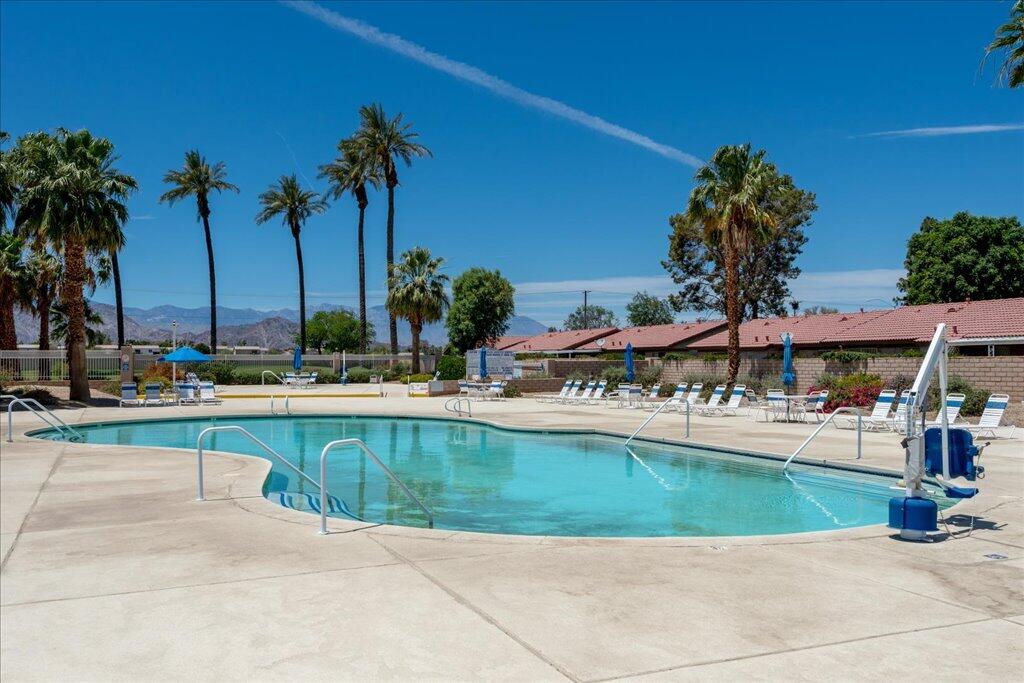 49562 Wayne Street Indio, CA 92201 - Photo 42 of 52 a view of a swimming pool with a patio