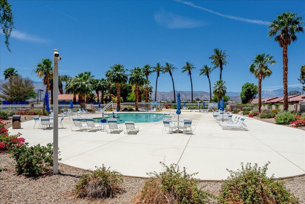 49562 Wayne Street Indio, CA 92201 - Photo 43 of 52 a view of swimming pool with outdoor seating and plants