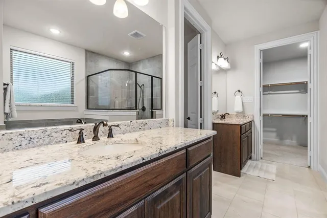 a bathroom with a sink toilet and a mirror