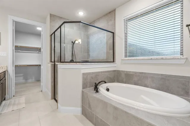 a view of a bedroom with baby crib and toys