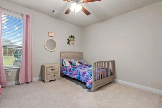 a view of a house with garden and patio