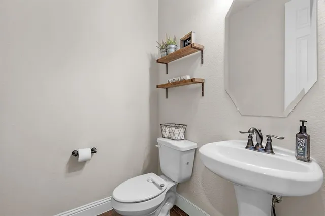 a picture of a bathroom with a shower