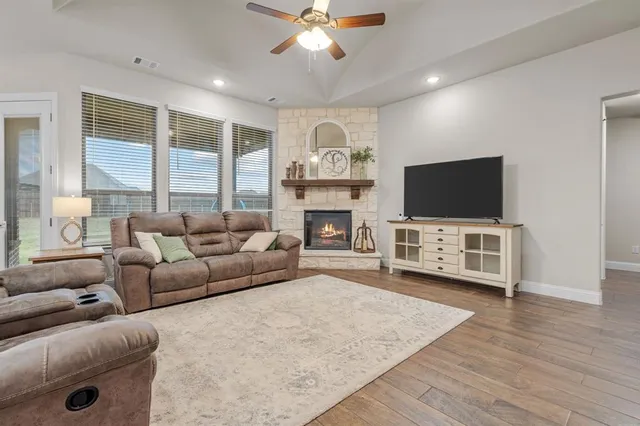 a living room with furniture and a fireplace