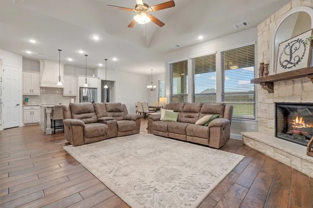 a view of a living room and kitchen counter space