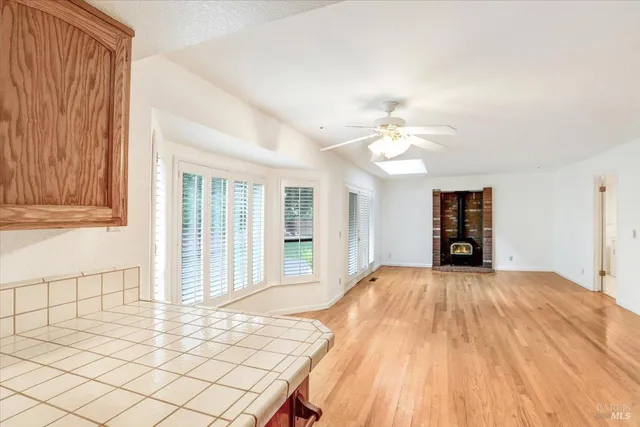 a view of a bedroom with wooden floor