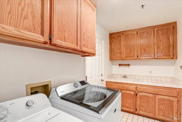 a kitchen with sink cabinets and a counter top space