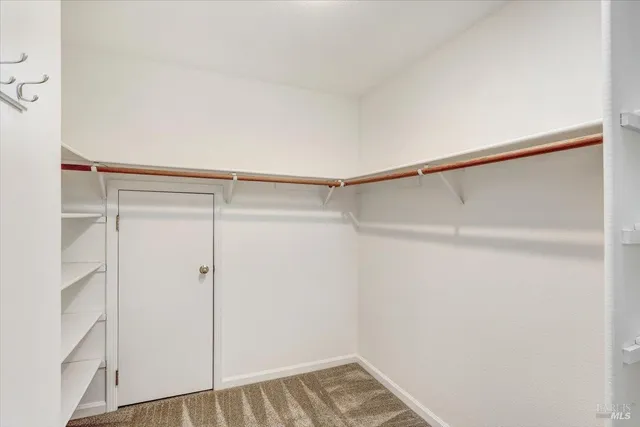a view of an empty walk in closet
