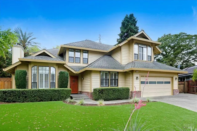 a front view of a house with a yard