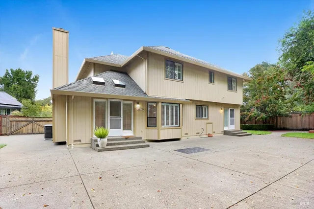 a front view of a house with a garden and porch