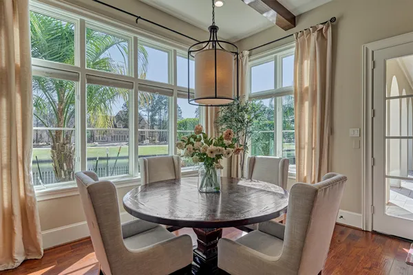 a view of a dining room with furniture window and wooden floor