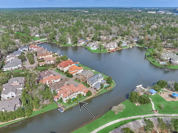 an aerial view of a houses with a lake view