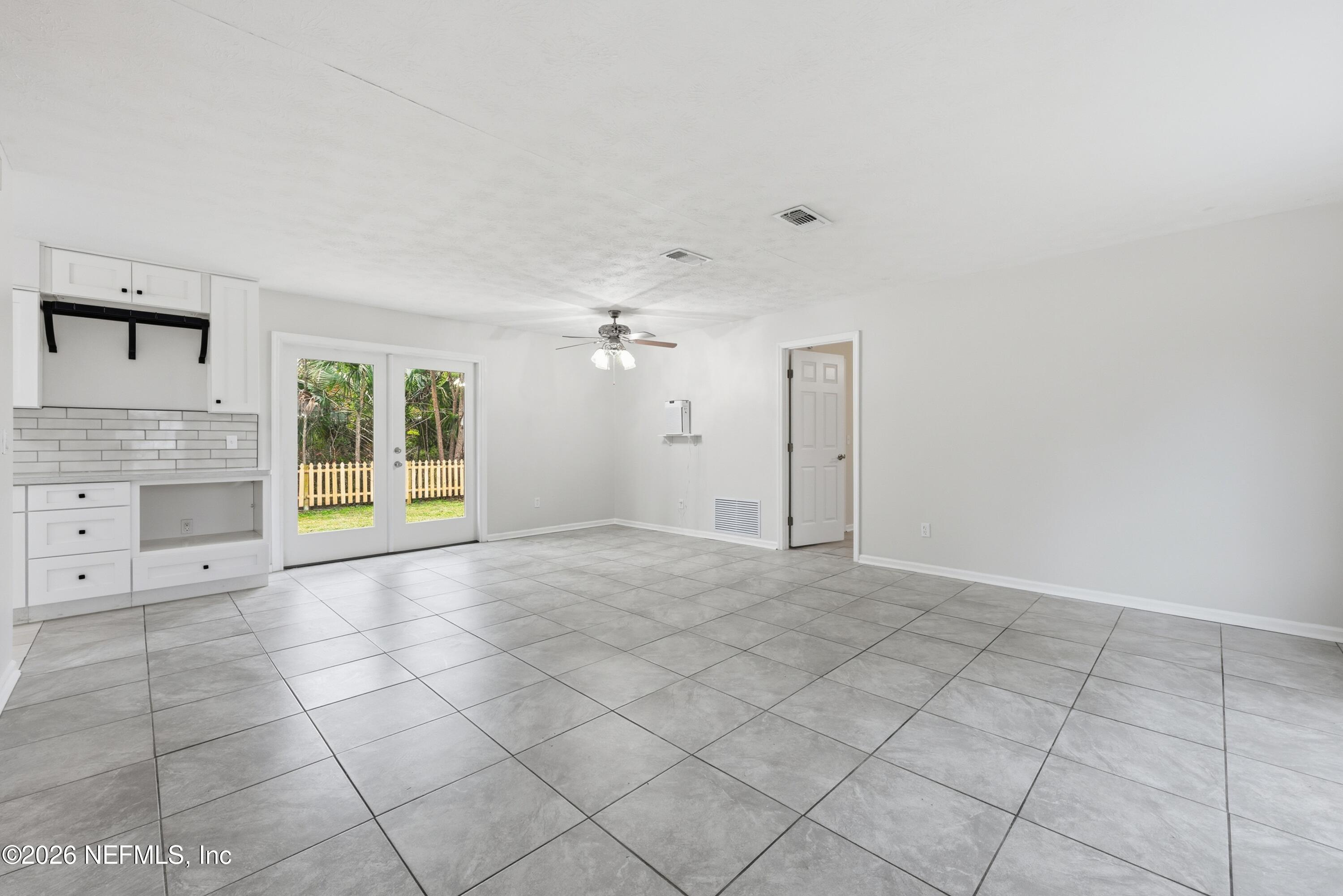 7 Cobia Street Ponte Vedra Beach, FL 32082 - Photo 8 of 20 a view of an empty room with a cabinet and a fireplace