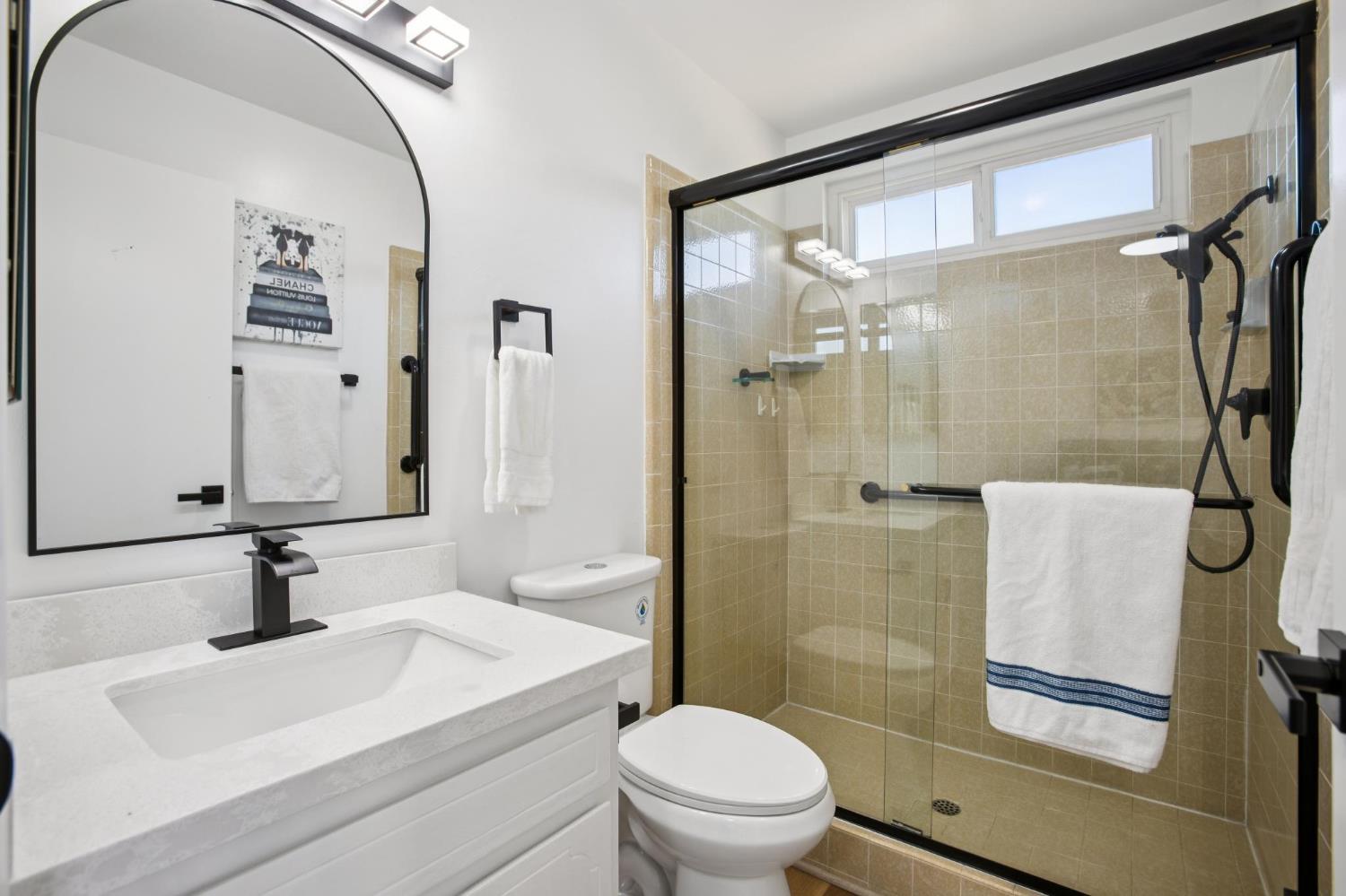 32402 Rutherford Lane Union City, CA 94587 - Photo 35 of 55 a bathroom with a sink toilet a mirror and shower