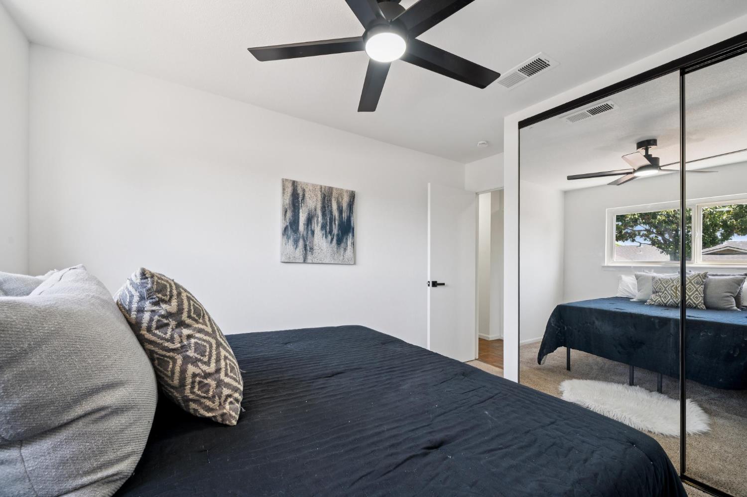 32402 Rutherford Lane Union City, CA 94587 - Photo 41 of 55 a bedroom with a bed and a lamp on the dresser