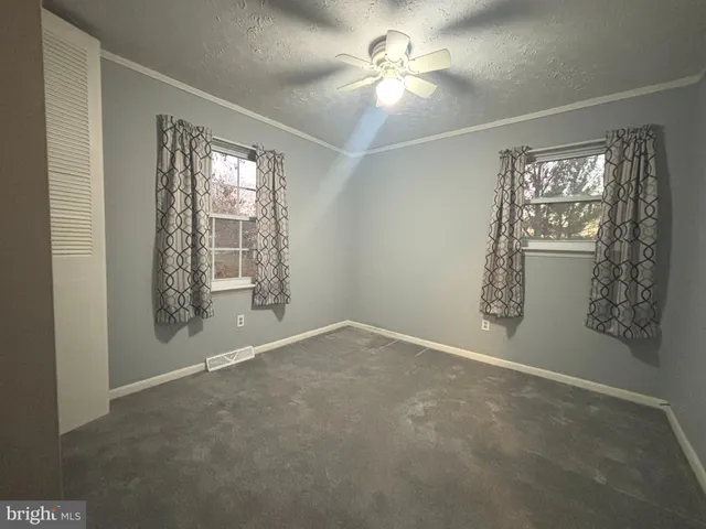 a kitchen with a stove and a microwave