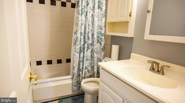 a picture of a bathroom with a window