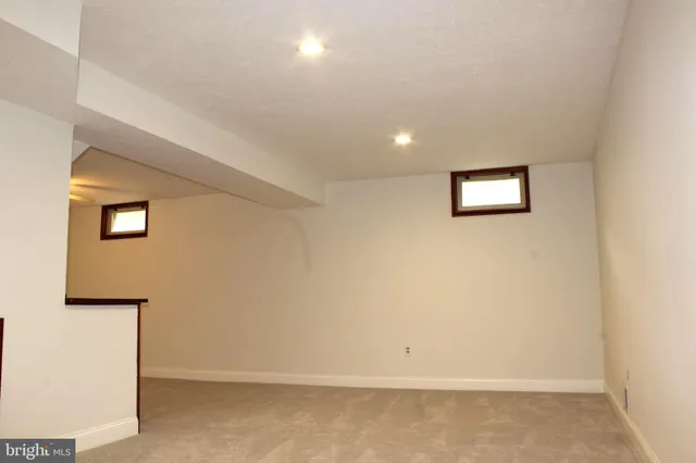 a view of a house with a backyard and a patio