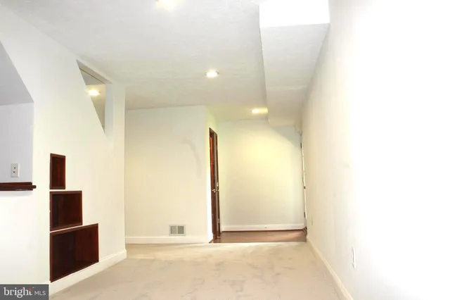 a house view with a sitting space and garden