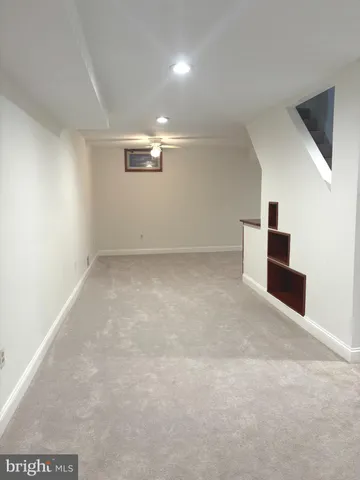 a view of house with a yard and potted plants