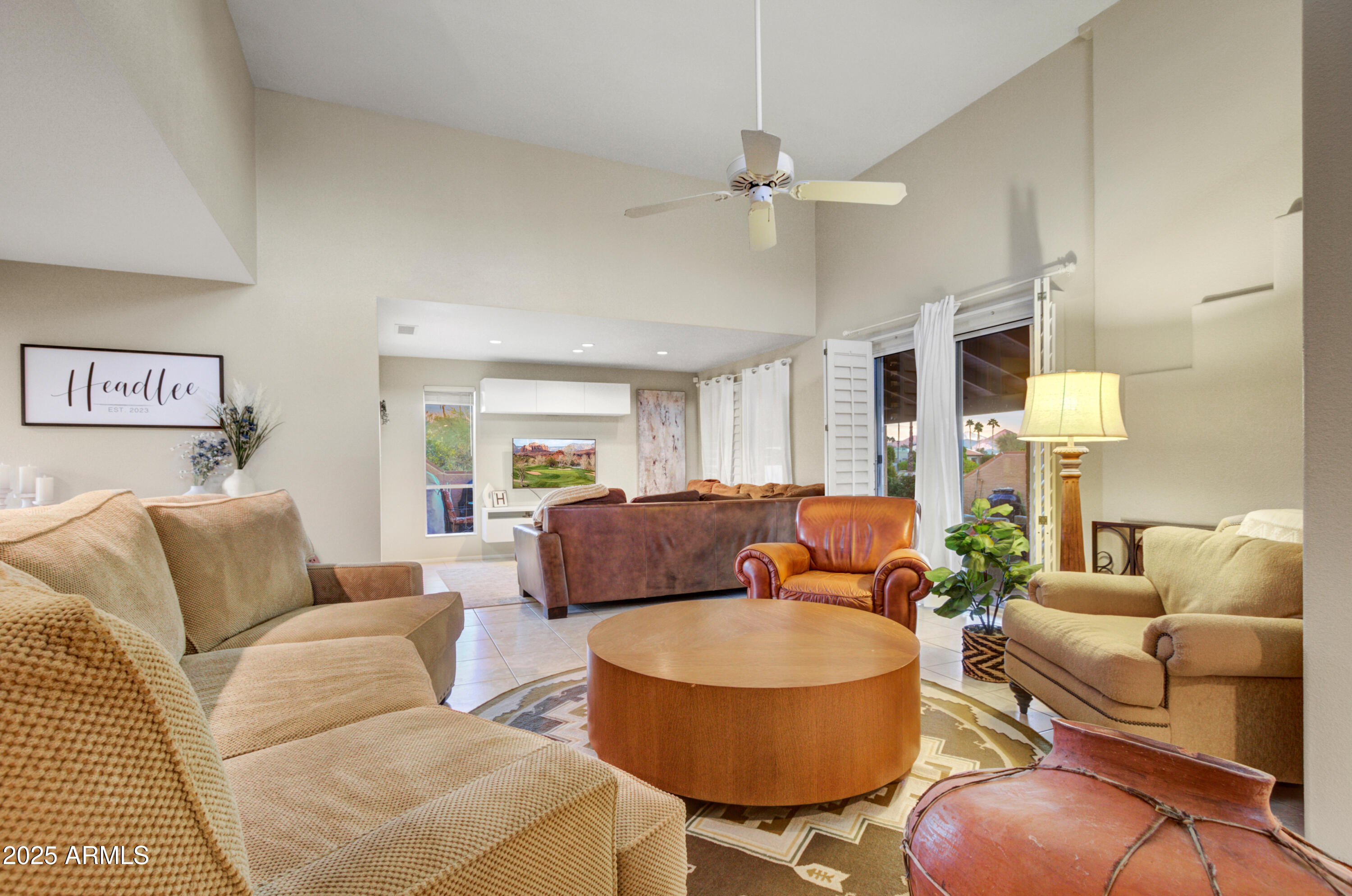 25828 North Primo Circle Rio Verde, AZ 85263 - Photo 3 of 21 a living room with furniture and a chandelier