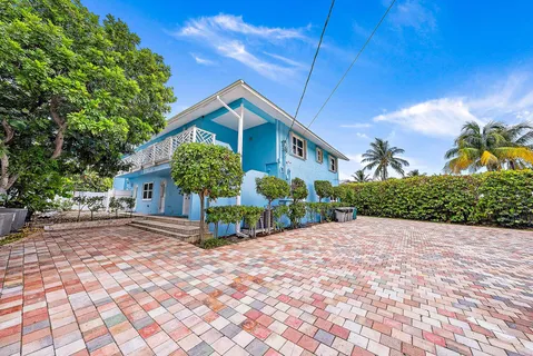 a view of a patio with table and chairs and potted plants