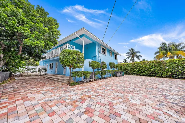 a view of a patio with table and chairs and potted plants