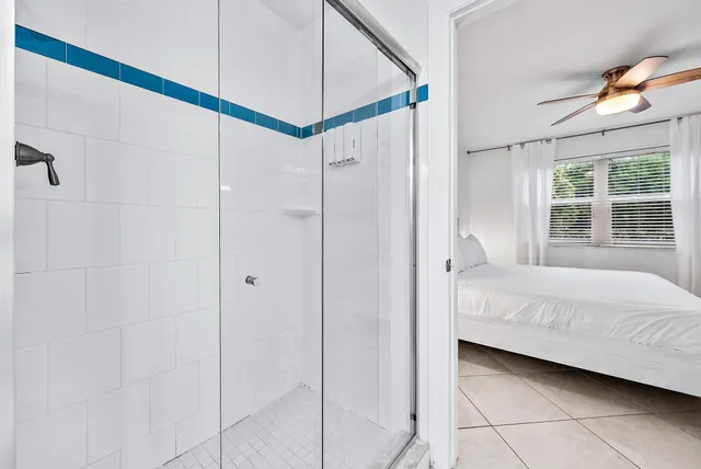 a living room with furniture a fireplace and a chandelier