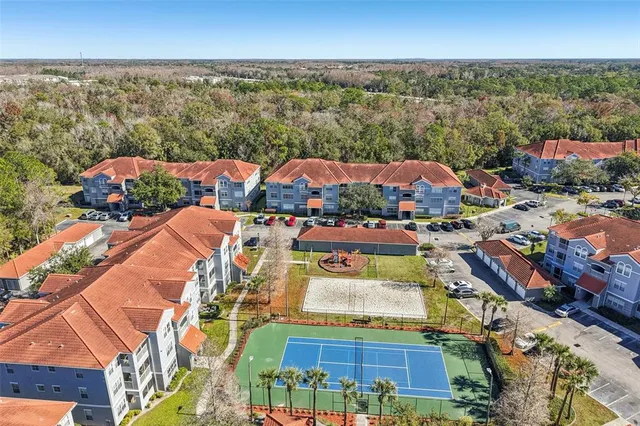 an aerial view of residential houses with outdoor space