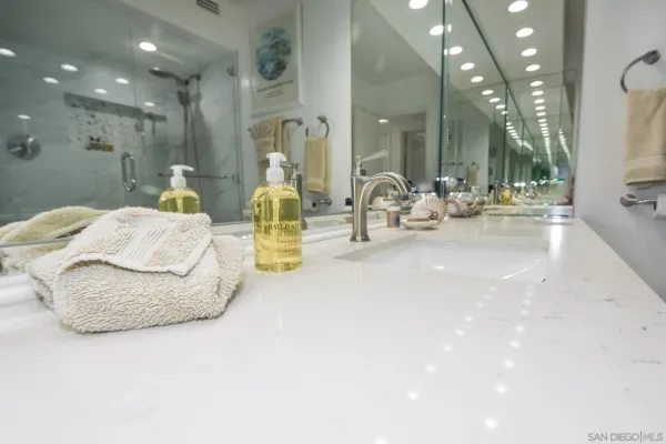 a bathroom with sink and mirror