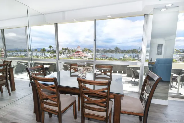 a view of a dining room with furniture window and outside view