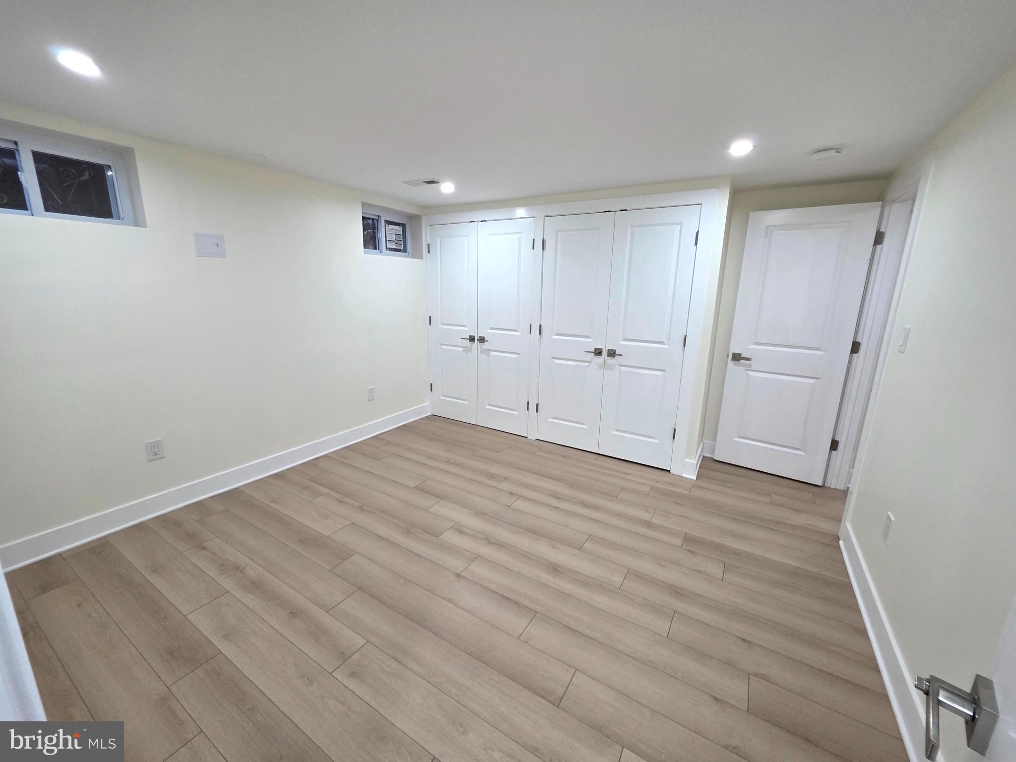 2206 Brinkley Road Fort Washington, MD 20744 - Photo 69 of 78 a view of a room with wooden floor and white doors