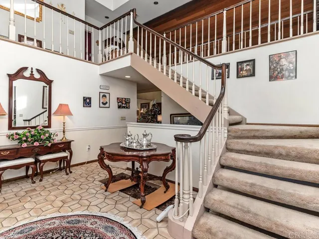 a living room with furniture a rug and a fireplace