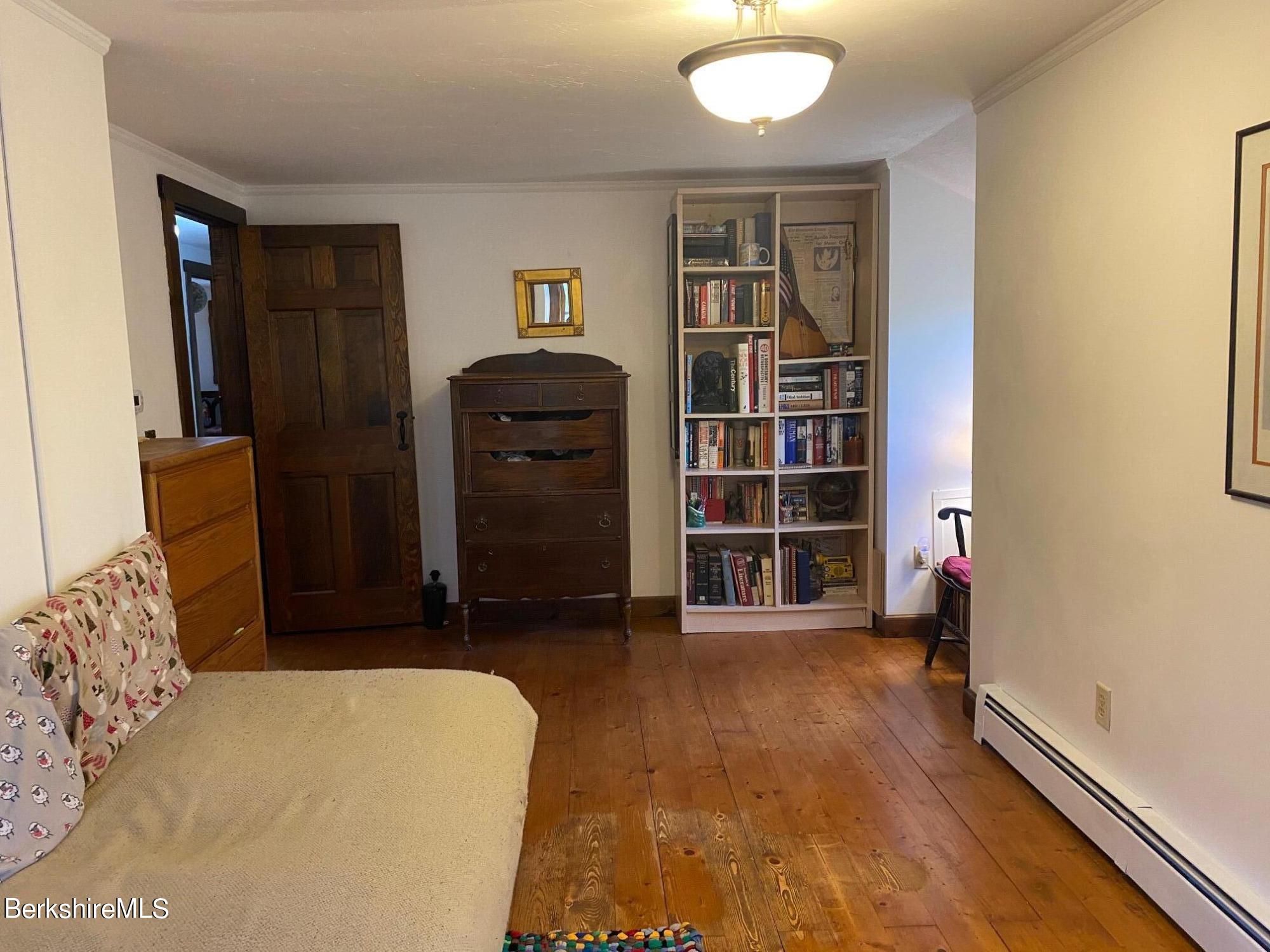 24 Andes Road Peru, MA 01235 - Photo 15 of 56 a bed room with a bed and a book shelf