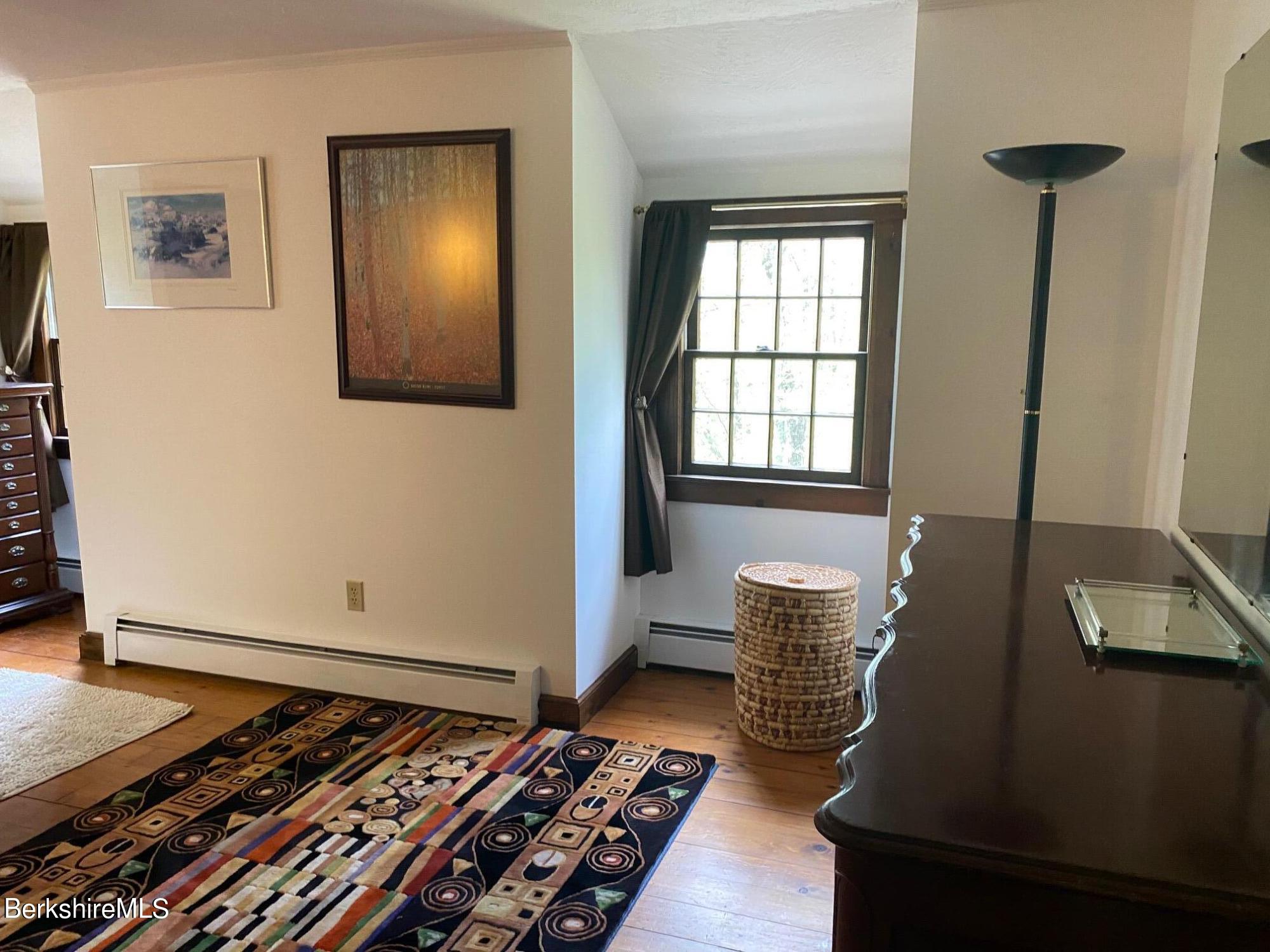 24 Andes Road Peru, MA 01235 - Photo 26 of 56 a living room with furniture and a rug