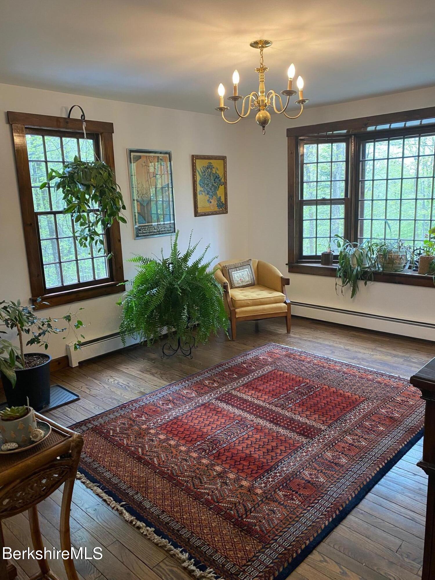 24 Andes Road Peru, MA 01235 - Photo 35 of 56 a living room with furniture and a floor to ceiling window