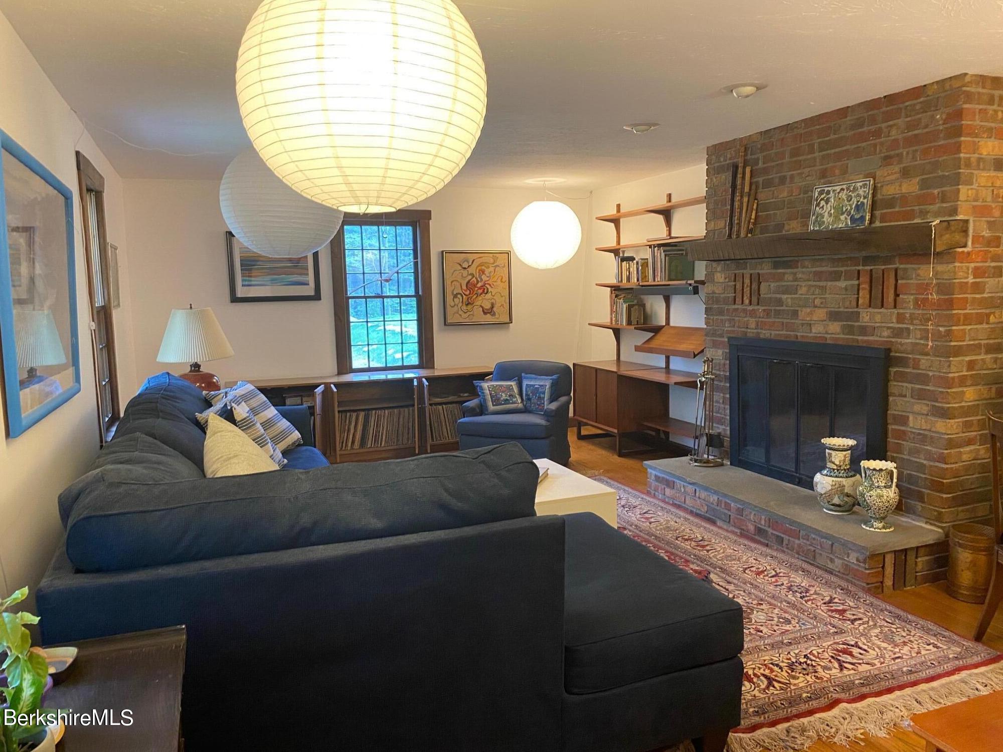 24 Andes Road Peru, MA 01235 - Photo 39 of 56 a living room with furniture and a fireplace