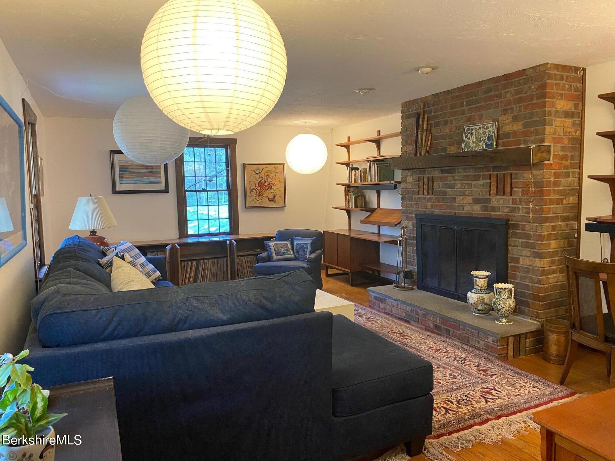 24 Andes Road Peru, MA 01235 - Photo 41 of 56 a living room with furniture and a fireplace