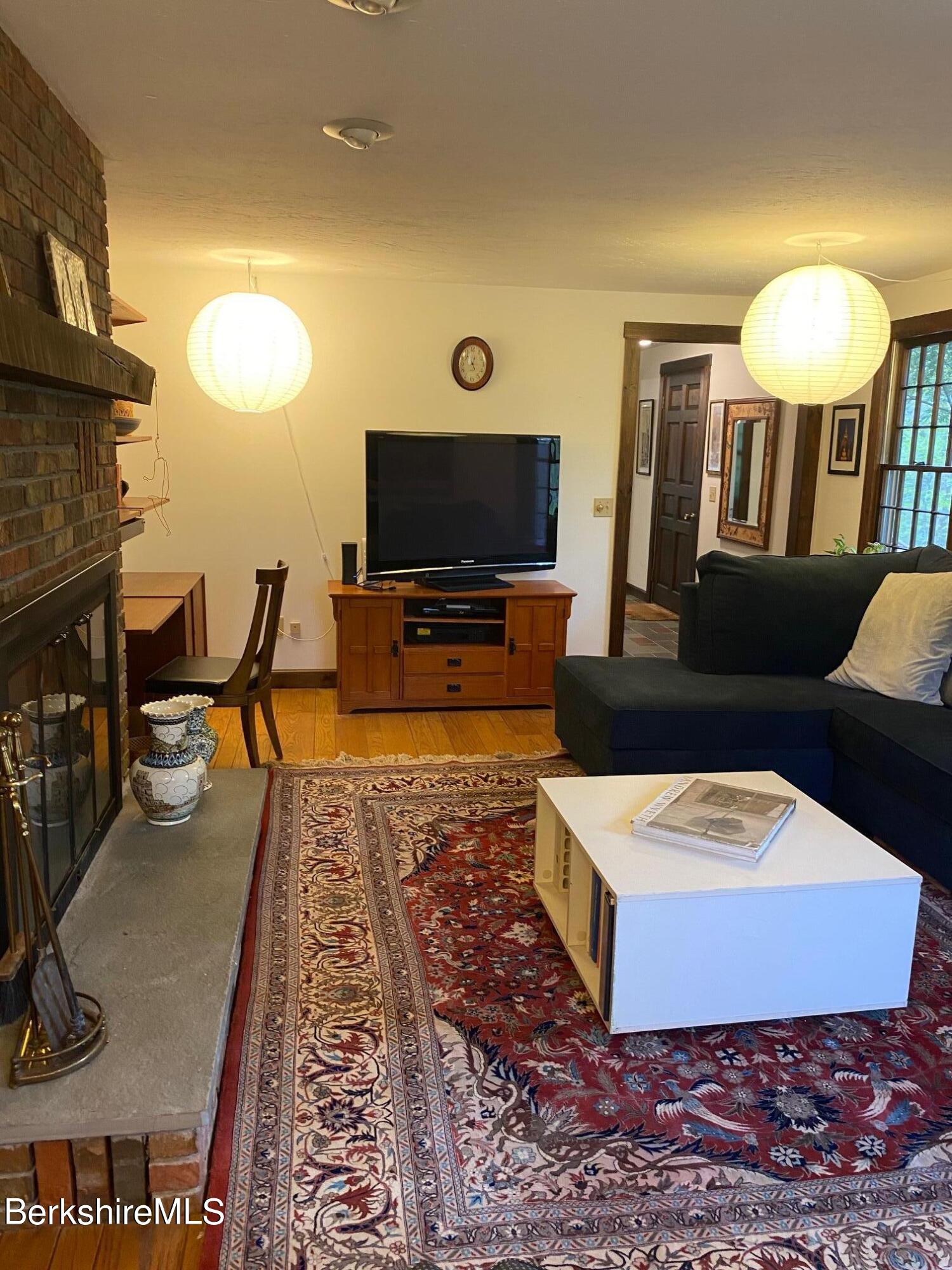 24 Andes Road Peru, MA 01235 - Photo 42 of 56 a living room with furniture and a flat screen tv
